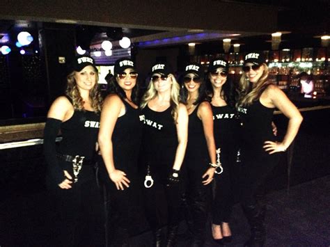 A Group Of Women Dressed In Black Posing For A Photo