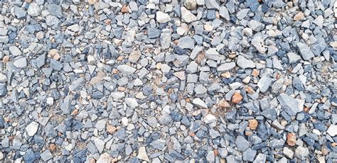 Pattern of small gravel, rock or stone on the ground for background. Hard material, Art ...