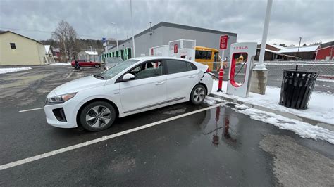 Magic Dock In Action Hyundai IONIQ Charging At A US Supercharger For