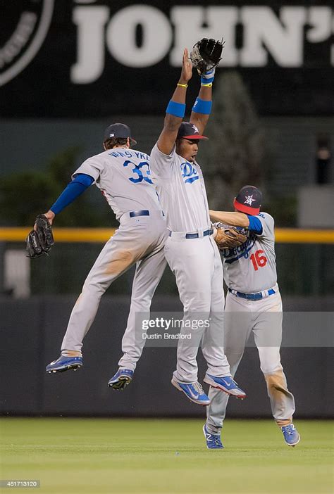 Los Angeles Dodgers outfielders, from left, Scott Van Slyke, Yasiel ...