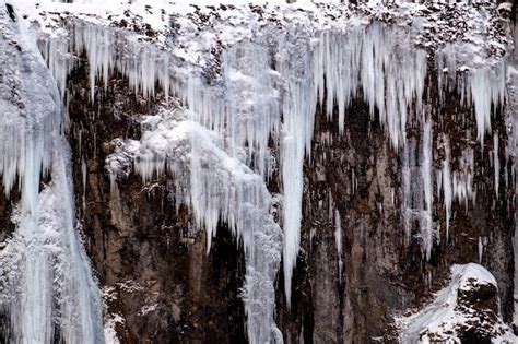 Premium Photo | Frozen waterfall near vik iceland