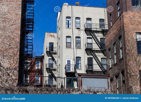 Old Residential Brick Apartment Buildings With Fire Escapes In Nolita