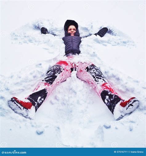 Happy Woman Making Snow Angel Stock Image - Image of woman, happy: 37516711
