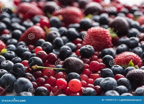 Selective Focus Of Red Fresh And Ripe Cranberries Strawberries