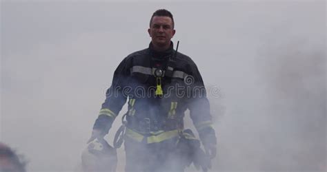 Portrait Of A Heroic Fireman In A Protective Suit Firefighter In Fire