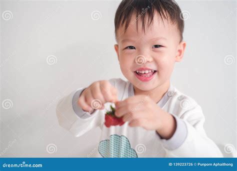 Little Asian 2 3 Years Old Toddler Baby Boy Child Using Hands Eating