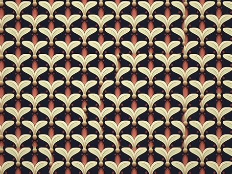 Premium AI Image A Brown And Gold Pattern With Leaves On A Black