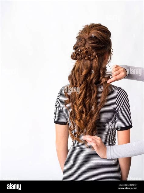 Wave curls hairstyle. Hairdresser making hairstyle to red brown hair ...