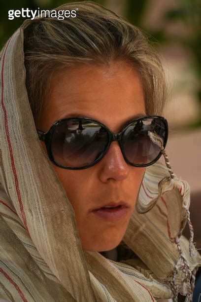 Portrait Of Beautiful Tourist Woman In Oman With Dark Sunglasses And