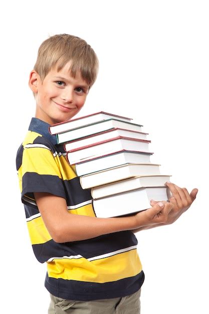 Menino Da Escola Segurando Livros Isolados Foto Premium