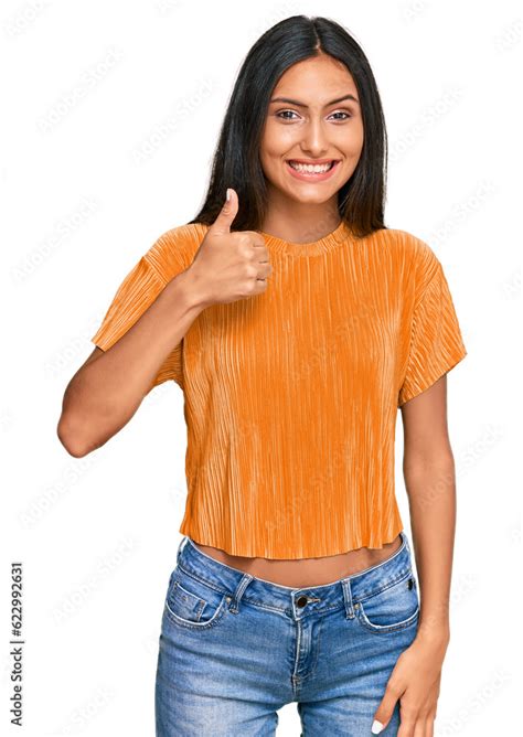 Young Brunette Arab Woman Wearing Casual Clothes Doing Happy Thumbs Up