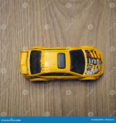 Top View Of A Yellow Mattel Hot Wheels Toy Car On A Wooden Surface Editorial Stock Photo Image