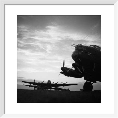 Avro Lancasters Of No 57 Squadron Lined Up At Dusk Before An Operatio