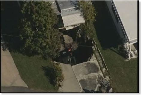 Expanding Sinkhole In Florida Swallows Car In Driveway Forces