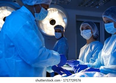 Team Professional Doctors Performing Operation Surgery Stock Photo