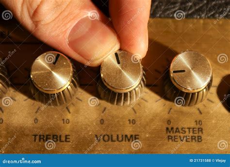 Fingers Adjusting A Volume Knob Royalty Free Stock Photos Image