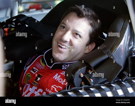 Driver Tony Stewart Laughs With Members Of His Crew Just Before Going