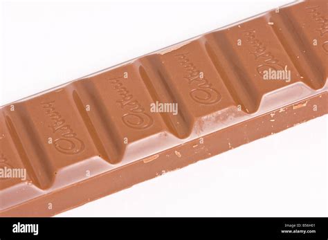 Cadburys Dairy Milk Chocolate Bar Unwrapped On White Background Stock