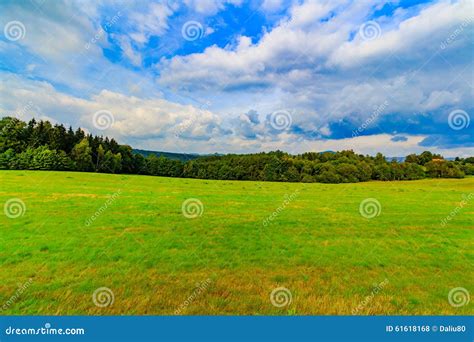 Panoramic Landscape Of Colorful Yellow Green Hills Blue Sky And Clouds