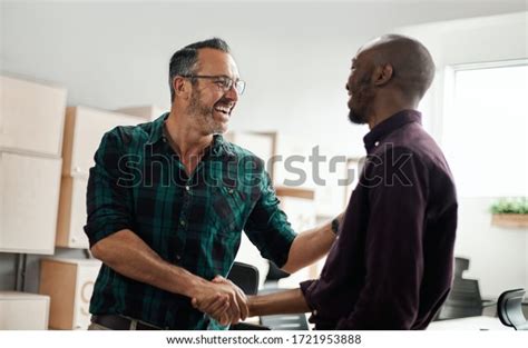 Two Smiling Happy Diverse Businessmen Shaking Stock Photo Edit Now