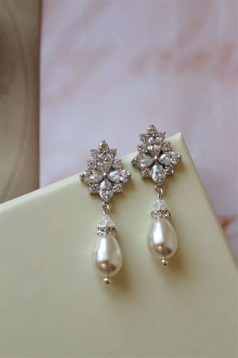 A Pair Of Natural Pearl And Diamond Drop Earrings Woolley And Wallis