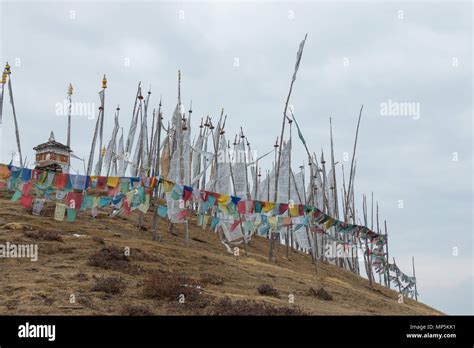 Prayer flags on a remote mountain summit, seen while hiking on the ...