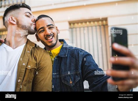 Portrait Of Happy Gay Couple Spending Time Together And Taking A Selfie