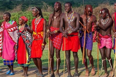 Premium Photo | Men from Masai Mara tribe in their red traditional ...