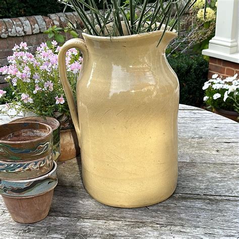 A Giant Milk Jug Litten Tree Antiques