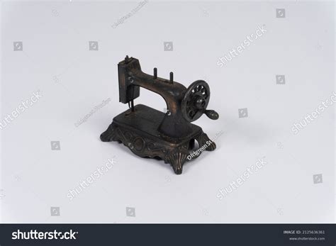 Vintage Miniature Sewing Machine White Background Stock Photo