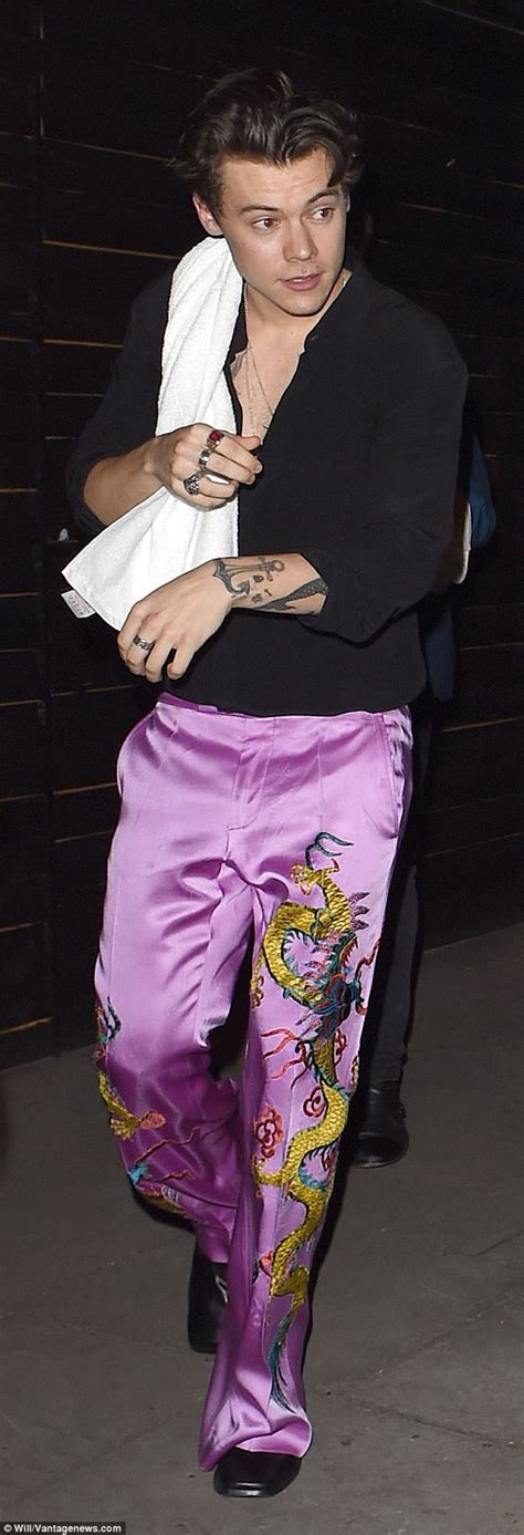 Harry Styles Leaves Londons Garage In Purple Silk Bottoms Daily Mail Online