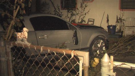 Driver Loses Control Crashes Through Fence