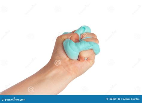 Kid Hand Holding And Squeezing Blue Slime In Front Of A White Stock