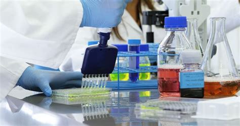 A Scientist Meticulously Conducts Experiments In A Well Equipped Lab