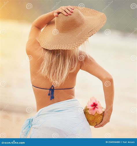 Lets Get Tropical Rearview Shot Of An Unidentifiable Woman In A Bikini Posing On A Tropical