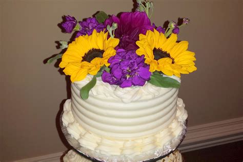 Sunflowers Bring A Bright Pop Of Color To The Top Tier Of This Cake