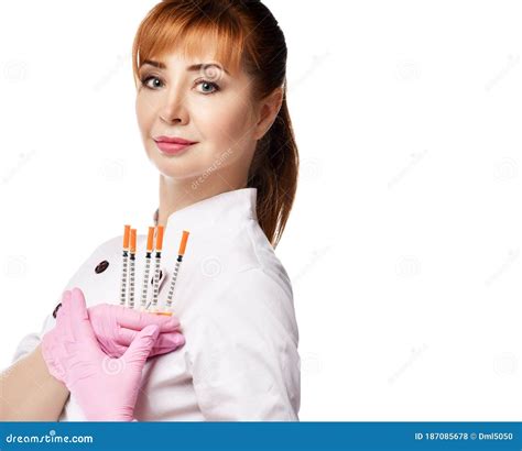 Young Beautiful Red Haired Woman Doctor Or Nurse In White Medical