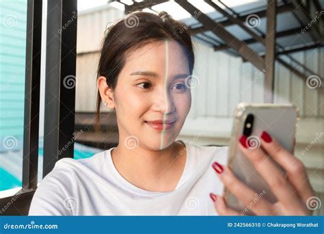 Asian Woman Is Checking Her Personal Data Scanning Her Face By Smart