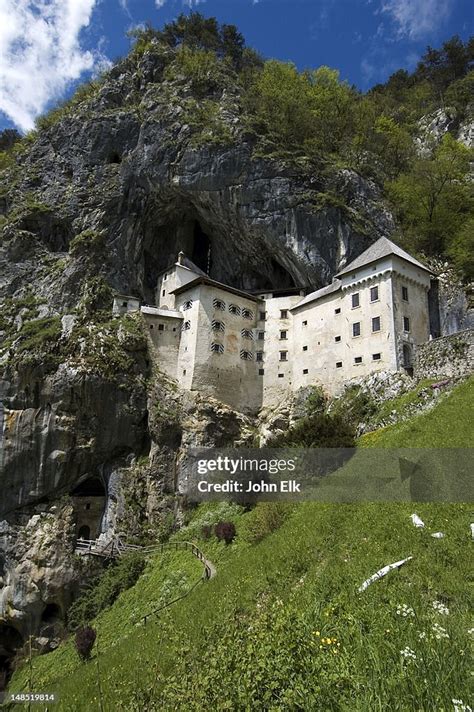 Predjama Castle Built Into Cave On Mountainside High Res Stock Photo