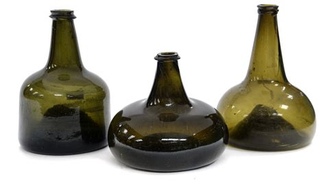 A 17th18th Century Mallet Form Glass Wine Bottle Circa 1700 Together