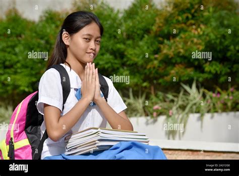 A Diverse Female Student In Prayer Stock Photo Alamy