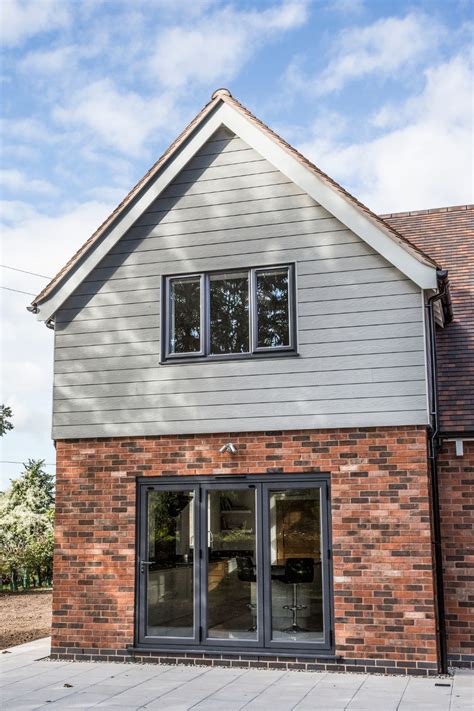 Traditional Home Clad With Cedral Facades In Classic House