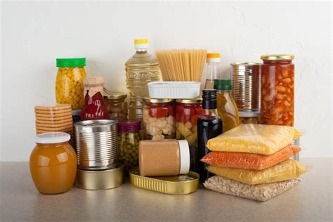 Premium Photo | Emergency survival food set on white kitchen table