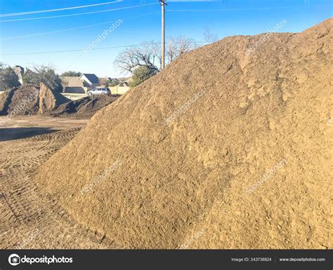 Large Heap Of Organic Topsoil Pile At Wholesale Compost Plant Near