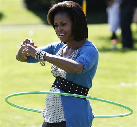 Michelle Obama hula hoops for health