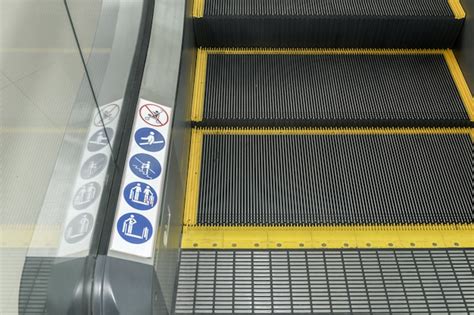 Premium Photo | Signs on an escalator, warning signs