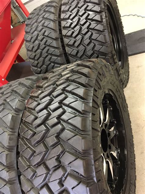 35x12 50R20 LT Nitto Trail Grappler M T Truck Tires And Black Rhino