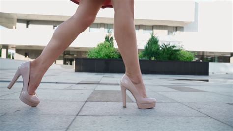 Sexy Successful Business Woman In A Pink Dress Walking In The City Park