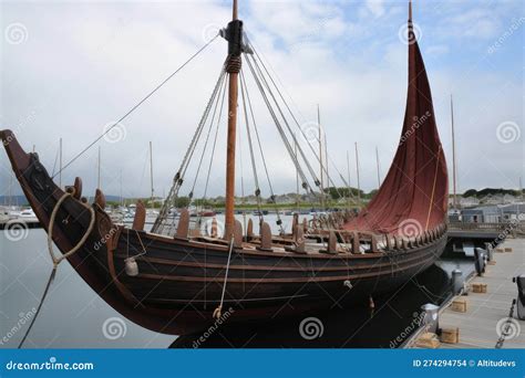 Full-scale Viking Ship Docked at Harbor, with Sails Furled and Oars in ...