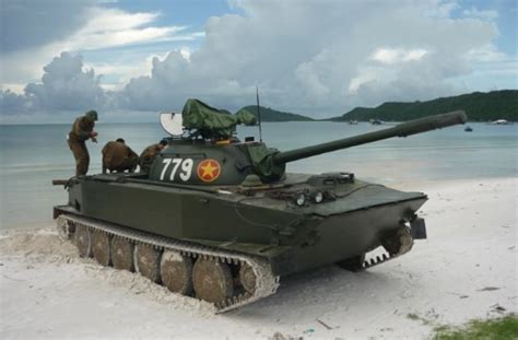 A Crew Of A Vietnamese Type 63 Light Tank Repairing Their Tank On The